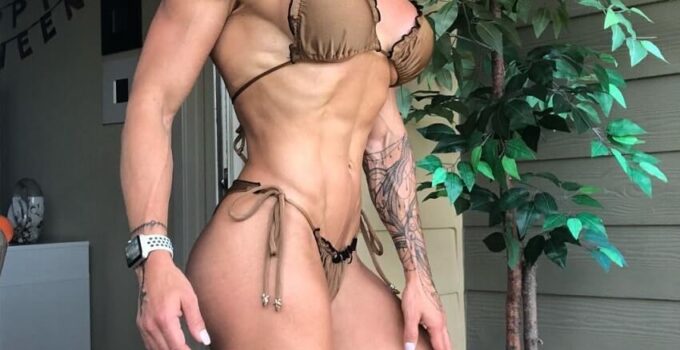 Dora Rodrigues posing in a bikini looking fit and strong
