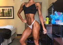 Jennifer Dorie flexing her abs and practicing posing