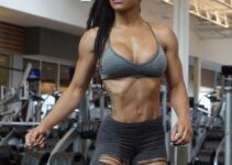 Lola Montez posing in the gym looking fit