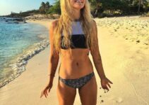 Rachel Brathen smiling on the beach, looking fit and healthy