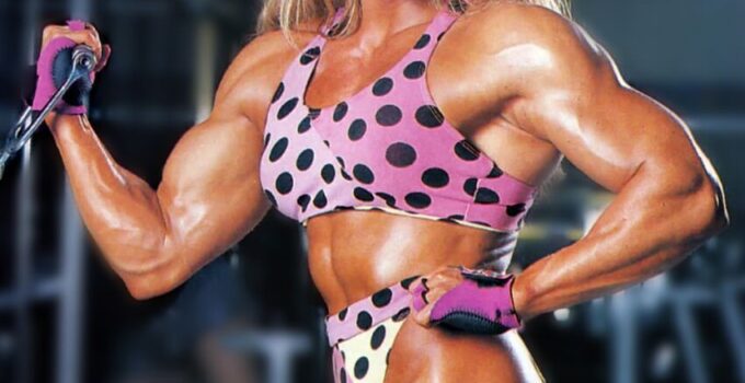 Sandy Riddell flexing her toned and lean physique in the gym