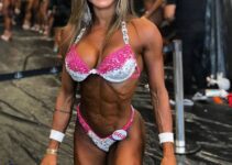 Susana Rodriguez posing backstage in her bikini, looking ripped and aesthetic