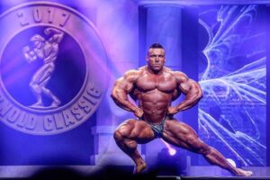 Luke Sandoe performing a pose routine on the Arnold Classic Stage