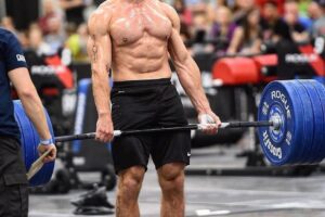 Alex Anderson lifting heavy barbell deadlifts during a CrossFit event