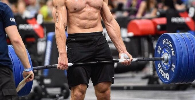 Alex Anderson lifting heavy barbell deadlifts during a CrossFit event