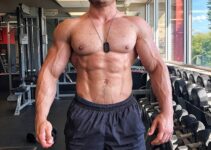 Caio Bottura posing shirtless in the gym