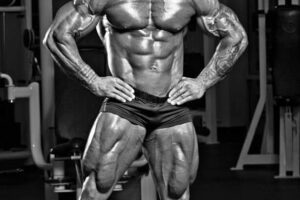 Caleb Blanchard posing shirtless in a gym