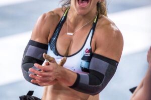 Kara Webb Saunders clapping and smiling during a CrossFit contest