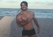 Lucas Giovani flexing on the beach looking fit and lean