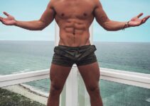 Max Wyatt posing on a balcony looking fit and lean