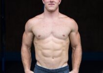 Noah Ohlsen posing shirtless for a photo looking fit and strong