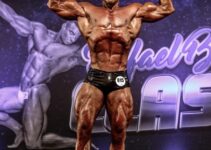 Renato Cariani hitting the front double biceps pose in a bodybuilding competition