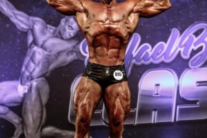 Renato Cariani hitting the front double biceps pose in a bodybuilding competition