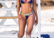 Rosanna Cordoba walking on the beach in her bikini, looking aesthetic and lean