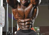 Toney Freeman flexing his abs in a professional bodybuilding photo shoot