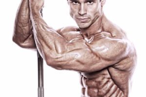 Matt Christianer holding a barbell in a photo shoot.