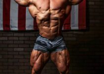 Derek Lunsford showing off his great physique while flexing his biceps.