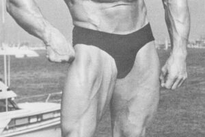 Eddie Giuliani posing for a photo showing off his muscular physique