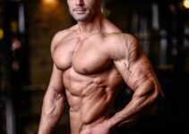 Mohammad Kashanaki posing for the picture, showing his ripped arms and shoulder, chest, abs, and obliques