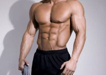 Ryan Hughes in a photo shoot showing off his shredded abs.