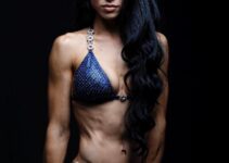 Stephanie Buttermore posing in a photo shoot looking extremely ripped