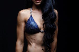 Stephanie Buttermore posing in a photo shoot looking extremely ripped