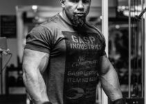 Tony Sentmanat in the gym with wraps around his wrists, looking massive and ripped